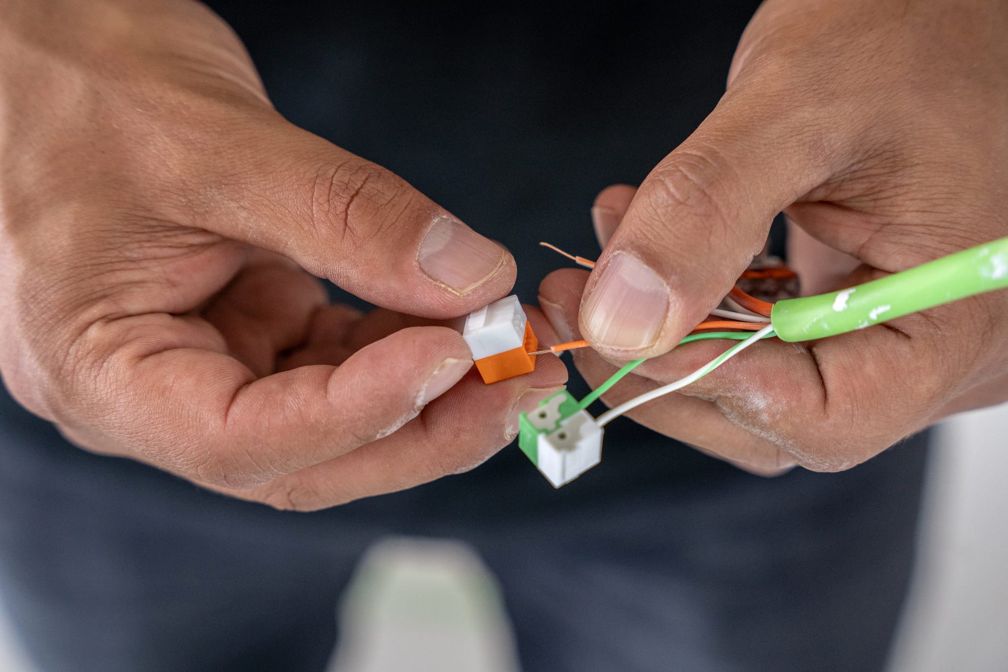 Cable being terminated during first fix