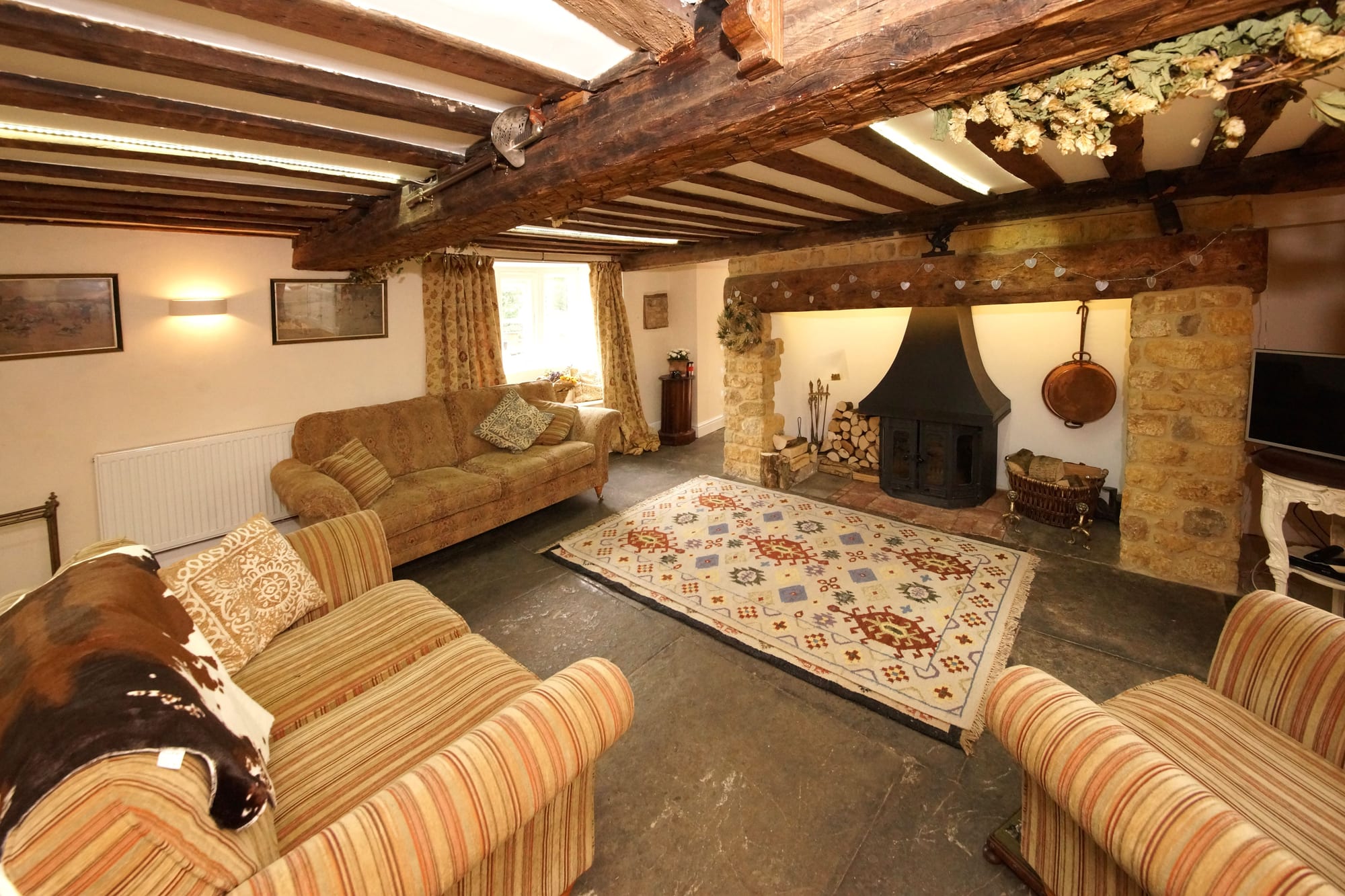 Beamed ceiling and inglenook in an English period cottage